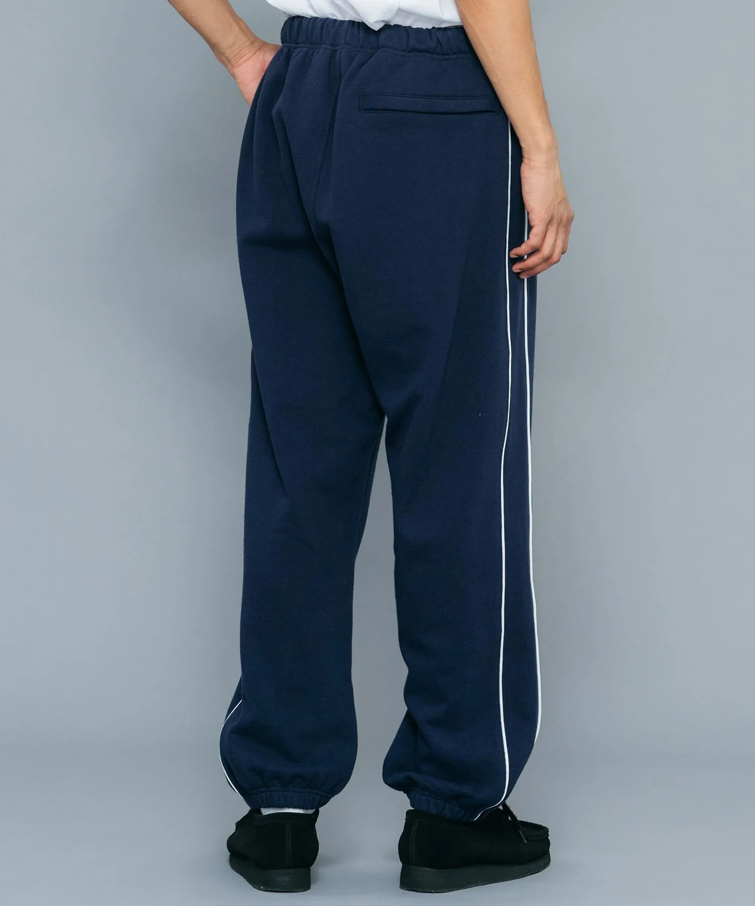 EMBROIDERED LOGO PIPING SWEAT PANTS